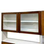 Load image into Gallery viewer, Wooden display cabinet with glass doors on a white background
