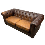 Load image into Gallery viewer, Brown leather sofa with tufted backrest on a white background
