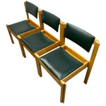 Load image into Gallery viewer, Three matching wooden dining chairs with dark green upholstered seats and backs, arranged in a row against a plain white background.
