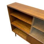 Load image into Gallery viewer, Mid-century modern wooden credenza or sideboard cabinet with open shelves and a glass-front cabinet door, shown on a white background.
