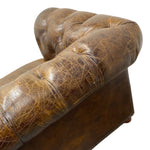 Load image into Gallery viewer, Close-up of a brown tufted leather armrest showing the detailed grain and stitching on a white background.
