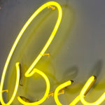 Load image into Gallery viewer, Neon sign with the word  BUDDY on a dark background
