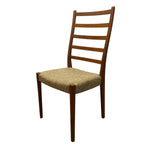 Load image into Gallery viewer, Wooden chair with a woven seat on a white background

