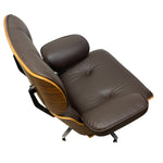 Load image into Gallery viewer, A mid-century modern lounge chair with dark brown leather upholstery, a wood-grain side panel, and a black metal base, shown on a plain white background.
