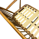 Load image into Gallery viewer, Close-up of a wooden chair or lounge chair showing the warm medium-brown wood frame and light natural woven seat slats against a white background.
