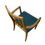 Load image into Gallery viewer, A mid-century modern wooden armchair with a curved oak frame and a teal blue upholstered seat cushion, shown from an elevated angle on a white background.
