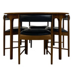 Load image into Gallery viewer, BLACK VINYL CHAIRS UNDER A TEAK INING TABLE 
