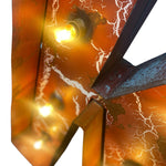 Load image into Gallery viewer, Close-up of a rustic metal wall light featuring a weathered orange-brown surface with white crackle detailing and glowing warm yellow bulbs.
