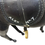 Load image into Gallery viewer, Black leather bag with 'ALEX' and 'No.7' written on it, attached to a black horse figurine.
