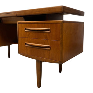 Wooden desk with two drawers on a white background