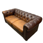 Load image into Gallery viewer, Brown leather sofa with tufted backrest on a white background
