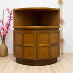 Load image into Gallery viewer, Wooden cabinet with curved top and two doors on a light wooden floor with decorative elements.
