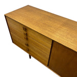 Load image into Gallery viewer, Mid-century modern wooden sideboard with five drawers on the left, a cabinet door on the right, and tapered legs, shown on a white background.
