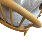 Load image into Gallery viewer, Close-up of a wooden sofa with a gray cushion on a white background
