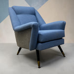 Load image into Gallery viewer, midcentury blue chair with geometric wall coverings
