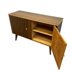Load image into Gallery viewer, Mid-century modern wooden sideboard cabinet with a dark brown wood grain finish, featuring a single door with a small round knob, two interior shelves, and an open front door showing the interior, photographed on a white background.
