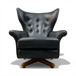 Load image into Gallery viewer, Black leather armchair with wooden base on a white background

