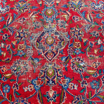 Load image into Gallery viewer, Close-up of a red patterned fabric with intricate designs
