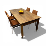 Load image into Gallery viewer, Wooden dining table with four chairs on a white background
