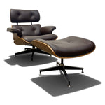 Load image into Gallery viewer, Mid-century modern Eames-style lounge chair with matching ottoman in dark brown leather, wood-look shell, and black five-star bases on a white studio background.
