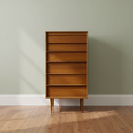 Load image into Gallery viewer, A mid-century modern wooden chest of drawers with five drawers and open shelves, standing on tapered legs against a sage green wall and light wood floor.
