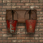 Load image into Gallery viewer, Two red fire buckets with visible wear hanging on a brick wall.
