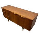 Load image into Gallery viewer, Mid-century modern wooden sideboard with three drawers on the left, two larger cabinet doors on the right, and tapered legs, shown on a plain white background.
