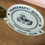 Load image into Gallery viewer, Decorative label with 'Handcraft Quality' text and furniture illustration on a wooden surface

