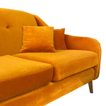 Load image into Gallery viewer, A close-up of a mustard yellow velvet sofa with matching accent pillows, showing the tufted backrest, seat cushions, and a single wooden leg against a plain white background.
