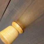 Load image into Gallery viewer, Close-up of a light natural wood cabinet knob on a dark brown wooden surface.
