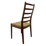 Load image into Gallery viewer, Wooden chair with a woven seat on a white background
