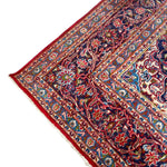 Load image into Gallery viewer, Close-up of a colorful patterned rug with intricate designs on a white background
