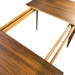 Load image into Gallery viewer, Close-up of a wooden table with a partially extended slide-out section, showing dark and light wood grain on a white background.
