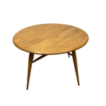 Load image into Gallery viewer, Wooden round table with four legs on a white background
