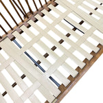 Load image into Gallery viewer, Close-up of a slatted bed frame with light beige woven slats over a medium brown wooden frame, shown against a white background.
