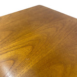Load image into Gallery viewer, A close-up of a polished wooden surface with a warm medium-brown finish and visible wood grain, photographed against a white background.
