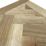 Load image into Gallery viewer, Close-up of a wooden floor with a herringbone pattern
