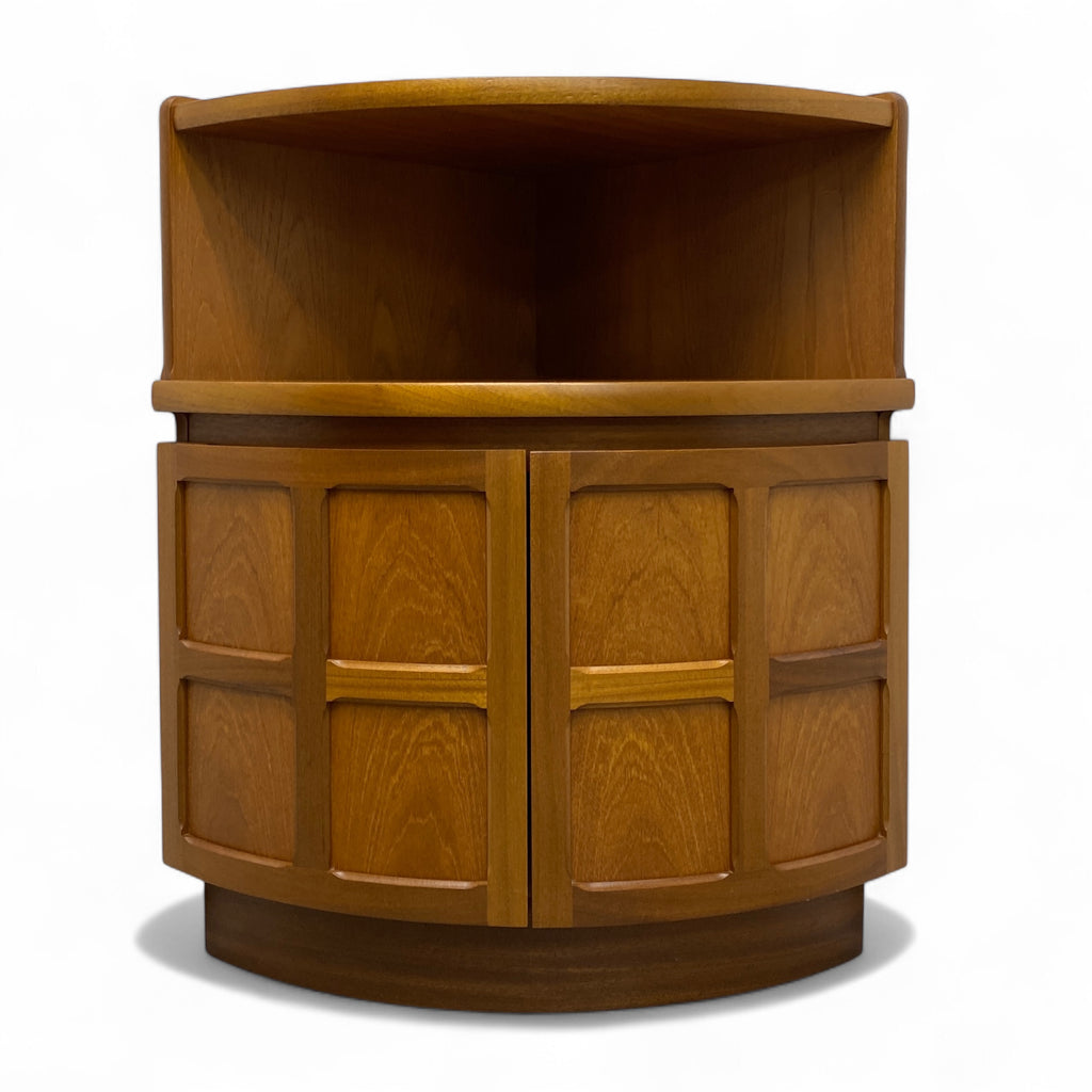 Wooden cabinet with curved top and panel doors on a white background