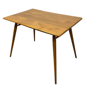Wooden table with four legs on a white background