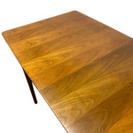 Load image into Gallery viewer, A close-up of a mid-century modern wooden table top with a warm honey-brown finish and visible wood grain, shown against a plain white background.
