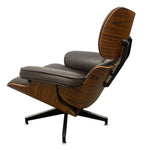 Load image into Gallery viewer, Mid-century modern lounge chair with dark brown wood grain shell and dark gray leather cushions on a black five-star base, isolated on a white background.
