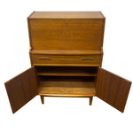 Load image into Gallery viewer, Mid-century modern wooden cabinet with a warm medium-brown finish, featuring a top drawer, two lower drawers with oval pulls, open side doors, and two interior shelves, shown on a plain white background.
