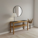 Load image into Gallery viewer, Wooden console table with round mirror and lamp against a beige wall.
