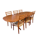Load image into Gallery viewer, Wooden dining table with six matching chairs on a white background
