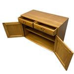 Load image into Gallery viewer, Wooden cabinet with open doors on a white background
