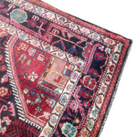 Load image into Gallery viewer, Close-up of a patterned rug with intricate designs on a white background
