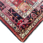 Load image into Gallery viewer, Close-up of a patterned rug with intricate designs on a white background
