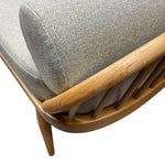 Load image into Gallery viewer, Close-up of a chair with a grEEN  cushion and wooden frame on a white background
