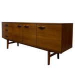 Load image into Gallery viewer, Mid-century modern wooden sideboard with six drawers and doors, featuring a warm walnut finish and dark metal handles, shown against a plain white background.
