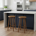 Load image into Gallery viewer, Two wooden bar stools in front of a kitchen island with modern appliances.
